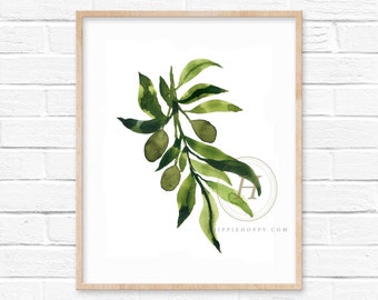 May include: A watercolour painting of an olive branch with green leaves and olives. The painting is framed in a light wood frame and has a white background.