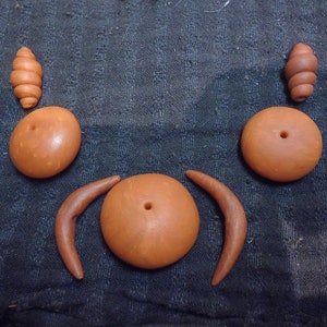 3 sets of fimo beads, many possible uses, amber color, largest horn shape 35mm end to end. largest pillow(center) is 20x30mm (set 5)
