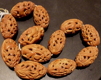 Rare old highly detailed Chinese carved olive pits, plants, flowers, people and animals. 12 beads, 16 x 28 mm (pits 1)