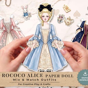 May include: A paper doll set featuring a central figure in a blue dress with a black bow, accompanied by additional outfits in pink and dark blue. The set includes small illustrations of a rabbit, teacups, and a teapot, with text reading ROCOCO ALICE PAPER DOLL.