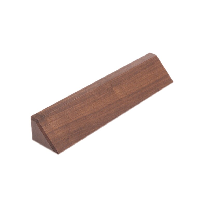 May include: A solid, triangular-shaped wooden object with a rich, dark brown finish. The piece has a flat top and a beveled edge, creating a geometric design. The wood grain is visible, adding texture to the minimalist design.