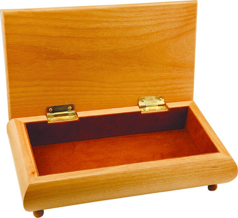 May include: Open wooden box with a hinged lid. The box is made of light-coloured wood with a reddish-brown interior lining. The box has brass hinges and small wooden feet.