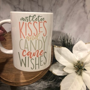 Mistletoe kisses candy cane wishes Ceramic Mug 15 oz.