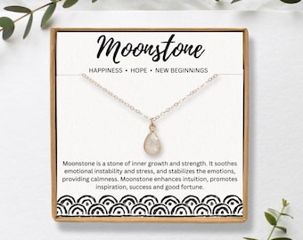 May include: A white moonstone pendant necklace on a gold chain in a white box with the words "Moonstone" and "Happiness, Hope, New Beginnings". The box also includes a description of the meaning of moonstone.