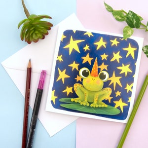 Carte de voeux vierge de magicien de la grenouille. Carte grenouille et étoiles. Carte d'anniversaire grenouille magique. Carte d'amant de grenouille. Carte fantaisiste