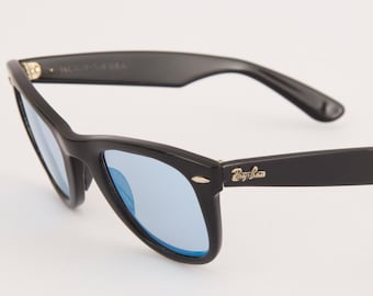 Gafas de sol Ray-Ban Wayfarer vintage / B&L USA, década de 1980 / Acetato negro / Lentes de espejo azules