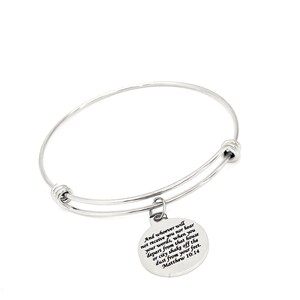 May include: A silver bangle bracelet with a charm that has the Bible verse "And whoever will not receive you nor hear your words, when you depart from that house or city shake off the dust from your feet. Matthew 10:14" engraved on it.