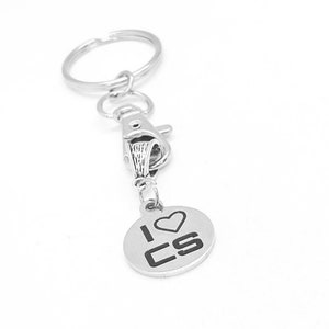 May include: Silver keychain with a round charm that says "I ♥ CS" in black lettering.