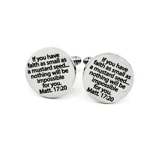 May include: A pair of silver cufflinks with the text "If you have faith as small as a mustard seed... nothing will be impossible for you. Matt. 17:20" engraved in black.
