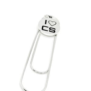May include: Silver bookmark with a round charm that says "I love CS" with a heart symbol.