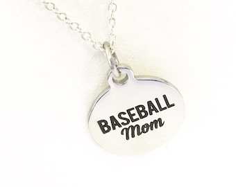 May include: Silver necklace with a round pendant that says "Baseball Mom" in black lettering.