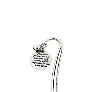 May include: Silver bookmark with a small round charm featuring a mustard seed. The bookmark has a quote from the Bible: "If you have faith as small as a mustard seed... nothing will be impossible for you. Matt. 17:20"