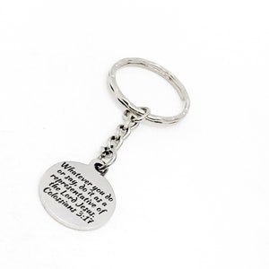 May include: Silver keychain with a round charm that reads "Whatever you do or say, do it as a representative of the Lord Jesus. Colossians 3:17"