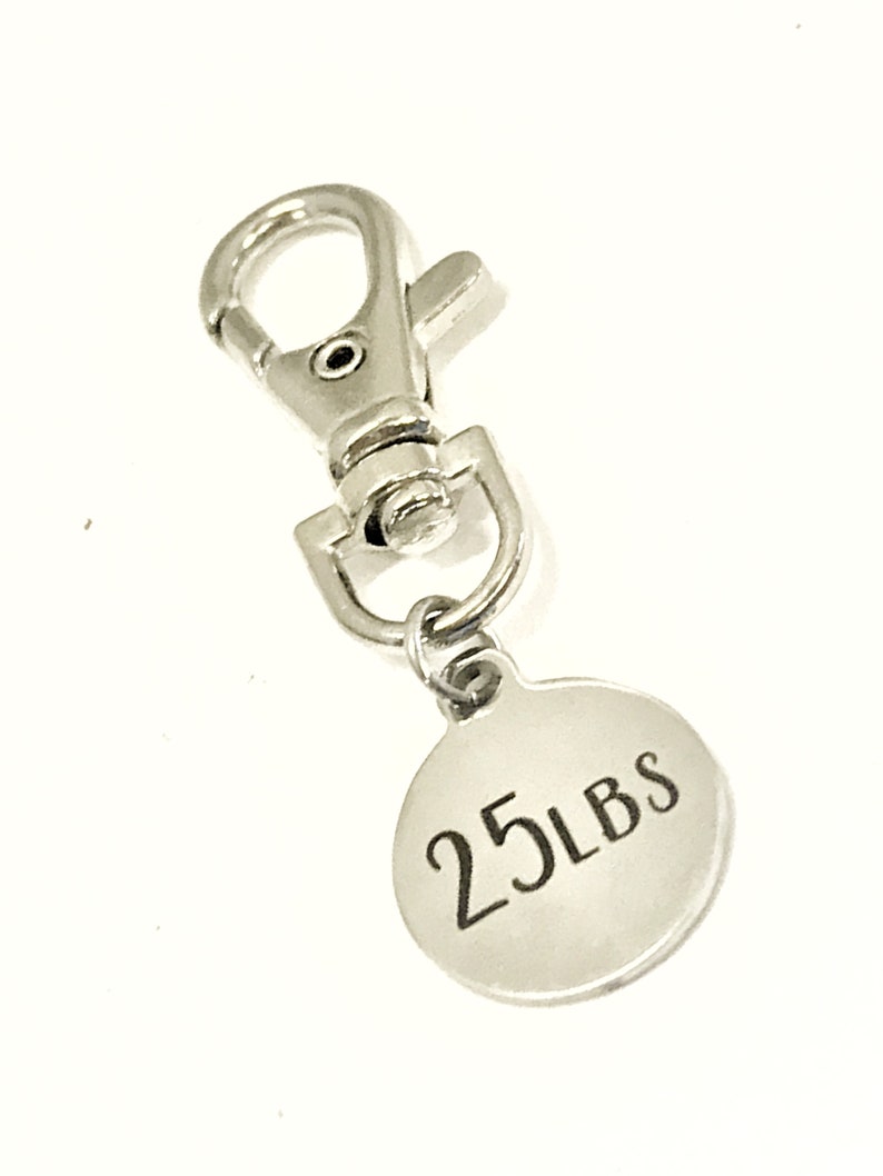 May include: Silver keychain with a round tag that says "25 LBS".