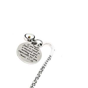 May include: Silver bookmark with a heart-shaped design and a round charm with the quote "If you have faith as small as a mustard seed... nothing will be impossible for you. Matt. 17:20".