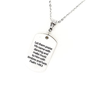 May include: Silver necklace with a dog tag pendant that reads "Let them praise His name with dancing and make music to Him with timbrels and harp. Psalm 149:3"