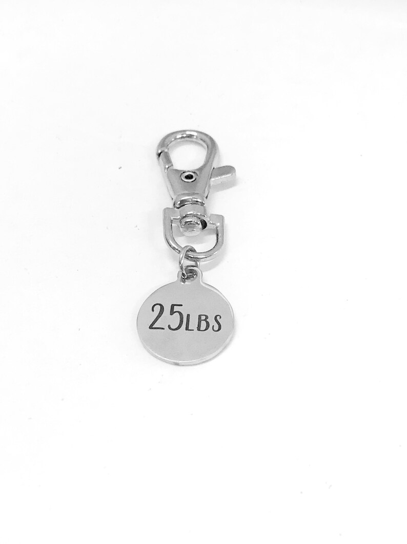 May include: Silver keychain with a round tag that says "25 LBS".