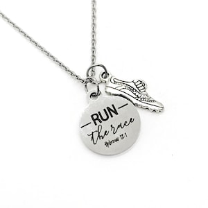 May include: A silver necklace with a round pendant that says "RUN the race Hebrews 12:1" and a small silver shoe charm.