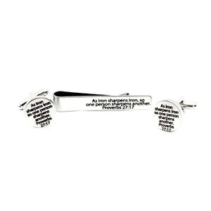 May include: A silver-toned tie clip and cufflinks set. The tie clip is rectangular, and the cufflinks are round. Each piece has the text "As iron sharpens iron, so one person sharpens another. Proverbs 27:17."