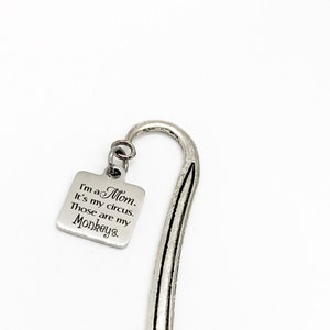 May include: Silver bookmark with a charm that reads "I'm a Mom. It's my circus. Those are my Monkeys."