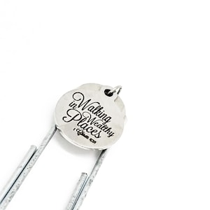 May include: Silver bookmark with a round charm that says "Walking in Wealthy Places" and a Bible verse reference.