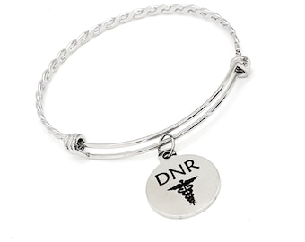 May include: A silver bracelet with a twisted chain design and a round charm with the text "DNR" and a medical symbol.