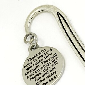 May include: Silver bookmark with a round charm that reads "Those who hope in the Lord will renew their strength. They will soar on wings like eagles; they will run and not grow weary. Isaiah 40:31"