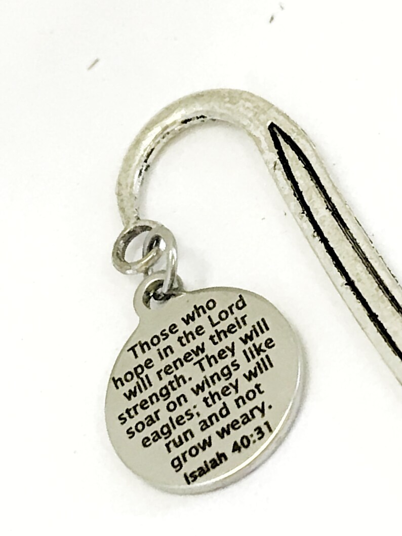 May include: Silver bookmark with a round charm that reads "Those who hope in the Lord will renew their strength. They will soar on wings like eagles; they will run and not grow weary. Isaiah 40:31"