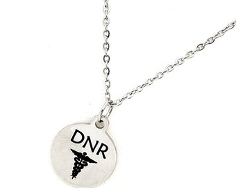 May include: A silver necklace with a round pendant that says "DNR" with a medical symbol.