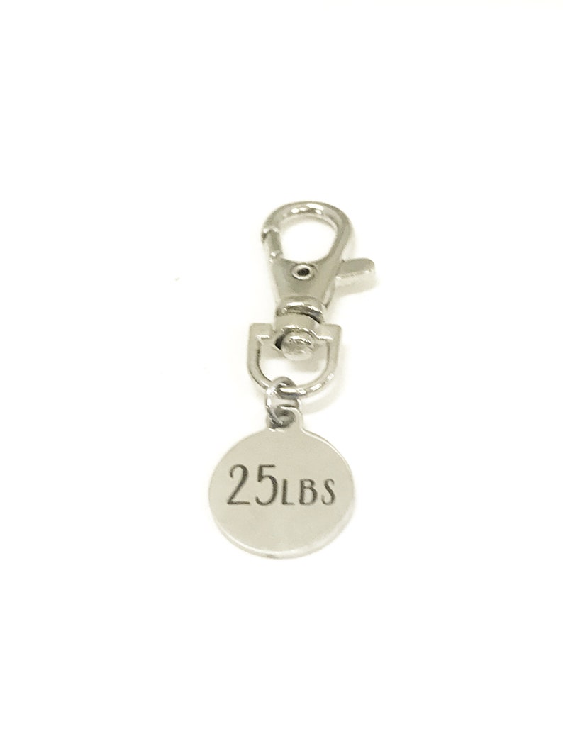 May include: Silver keychain with a round tag that says "25 LBS".
