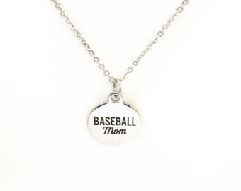 May include: Silver necklace with a round pendant that says "Baseball Mom" in black lettering.