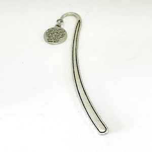 May include: Silver bookmark with a round charm featuring a bible verse: "Those who hope in the Lord will renew their strength. They will soar on wings like eagles; they will run and not grow weary." Isaiah 40:31