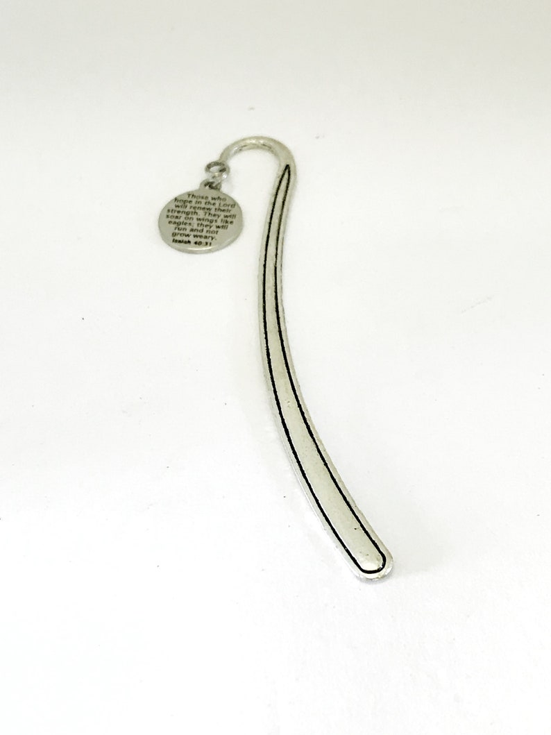 May include: Silver bookmark with a round charm featuring a bible verse: "Those who hope in the Lord will renew their strength. They will soar on wings like eagles; they will run and not grow weary." Isaiah 40:31