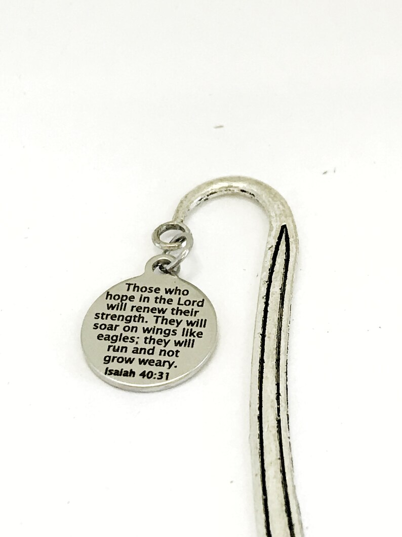 May include: Silver bookmark with a round charm featuring the text "Those who hope in the Lord will renew their strength. They will soar on wings like eagles; they will run and not grow weary. Isaiah 40:31"