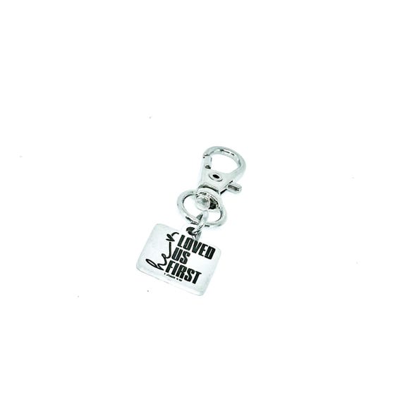 He Loved Us First Clip On Charm, Christian Keychain 1 John 4 19 Bible Verse Faith Gift For Her Religious Zipper Pull Purse Inspirational