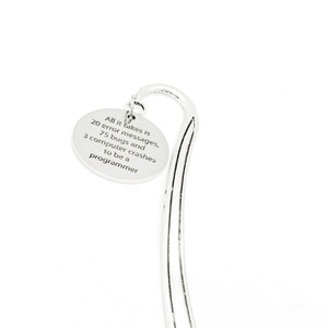 May include: Silver bookmark with a round charm that reads "All it takes is 20 error messages, 75 bugs and 3 computer crashes to be a programmer".