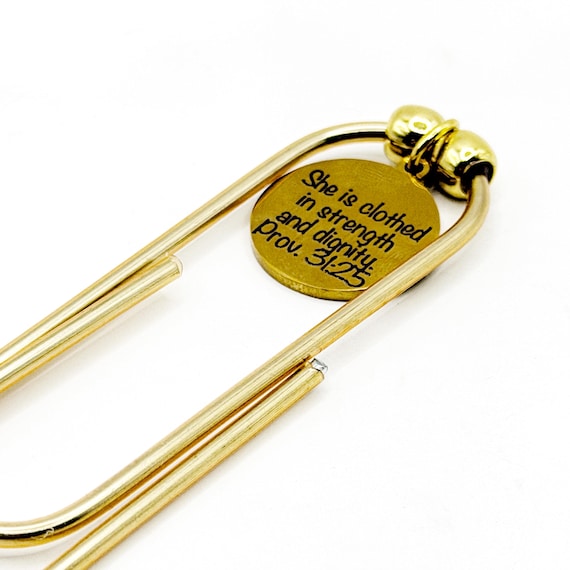 She Is Clothed Goldtone Bookmark Print Font