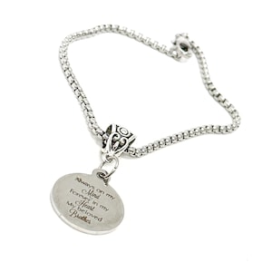 May include: Silver chain bracelet with a round pendant that reads "Always on my Mind Forever in my Heart My Beloved Brother".