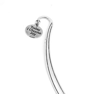 May include: Silver bookmark with a charm that reads "Today I Choose Joy".