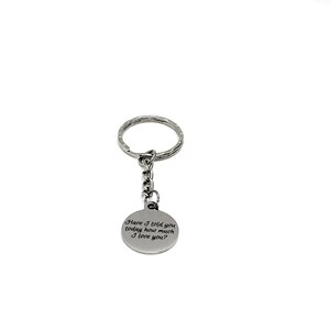 May include: Silver keychain with a round charm that reads "Have I told you today how much I love you?"