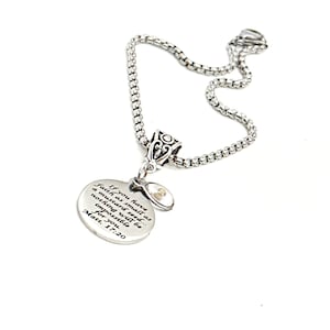 May include: A silver necklace with a round pendant that reads "If you have faith as small as a mustard seed... nothing will be impossible for you Matt. 17:20".