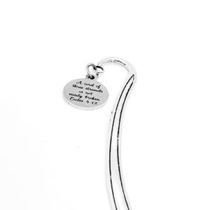 May include: Silver bookmark with a round charm that reads "A cord of three strands is not easily broken Eccles 4:12".