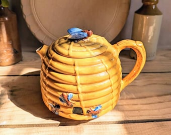 A vintage 1930s Thomas Hughes 'honey bee and hive tea pot Art Deco Pottery Teapot