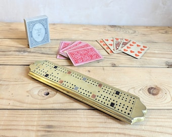 A vintage brass Cribbage board  C1900