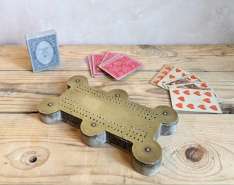 A vintage Cribbage board  C1900 - scratch made brass and oak cribbage board.