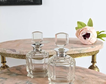 A pair of exquisite Art Deco antique cut glass scent bottles with solid silver mounts,  Hallmarked London 1932/33