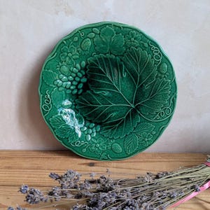 An Antique Majolica Plate - Antique Victorian Majolica dark green glazed plate with traditional vine leaf design C1880 Slight Chip to rear