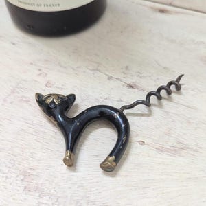 An vintage brass &#39;Gunga Din&#39; cat corkscrew C1950