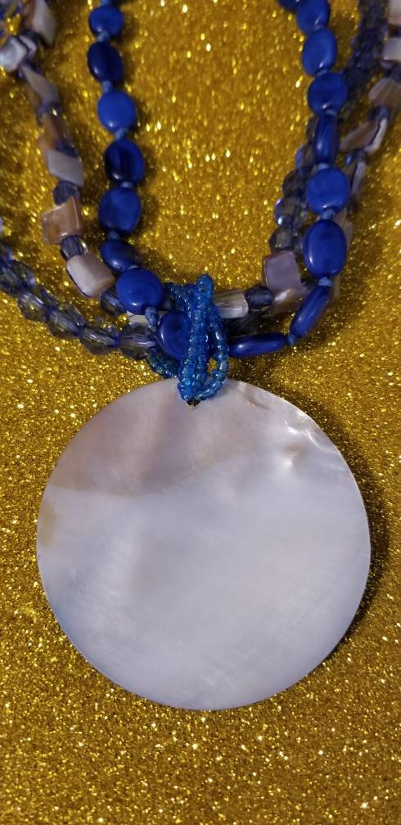shell beads Multistrand mother of pearl One of my earlier pieces of jewelry. Adjustable from 18 to 20 inches and plastic beads necklace