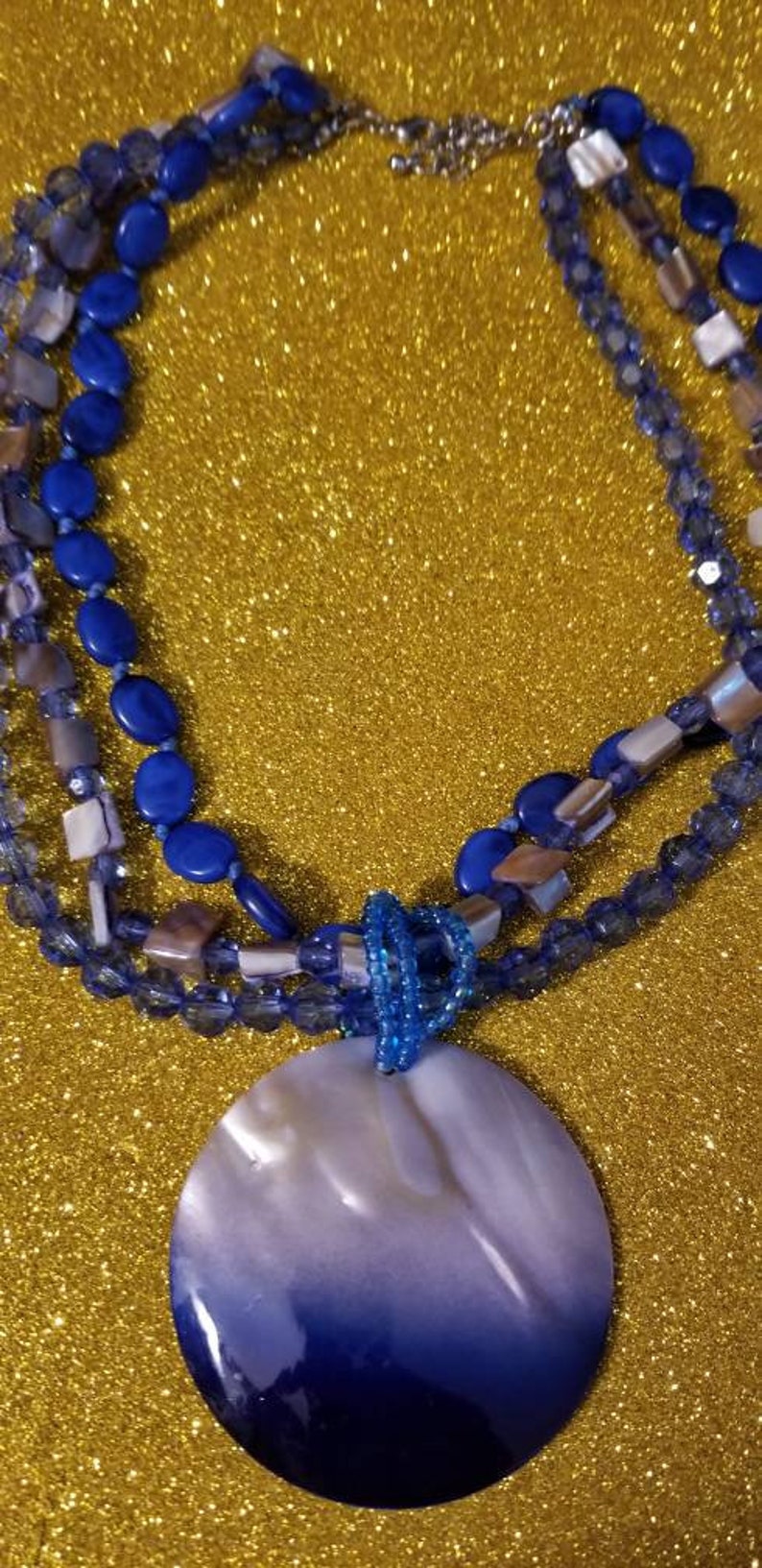 shell beads Multistrand mother of pearl One of my earlier pieces of jewelry. Adjustable from 18 to 20 inches and plastic beads necklace